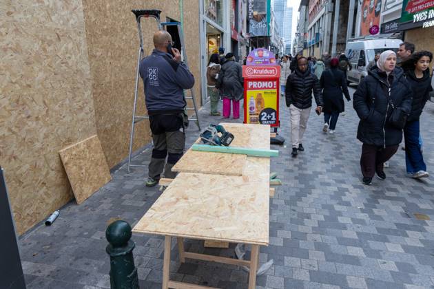 Storefronts boarded up with wooden panels at Rue Neuve Nieuwstraat, in Brussels, on Friday 23 October 2026. Stores are preparing for another protest scheduled for Saturday.  NICOLASxMAETERLINCK 190739543