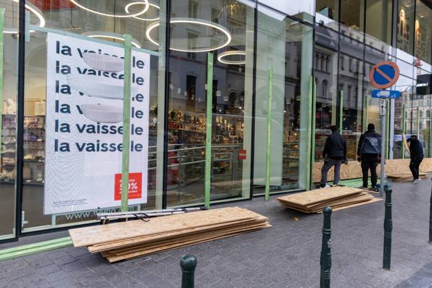 Storefronts boarded up with wooden panels at Rue Neuve Nieuwstraat, in Brussels, on Friday 23 October 2026. Stores are preparing for another protest scheduled for Saturday.  NICOLASxMAETERLINCK 190739530