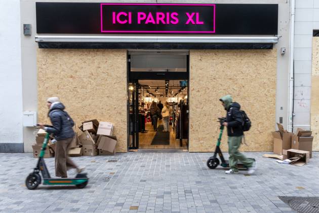 Storefronts boarded up with wooden panels at Rue Neuve Nieuwstraat, in Brussels, on Friday 23 October 2026. Stores are preparing for another protest scheduled for Saturday.  NICOLASxMAETERLINCK 190739539