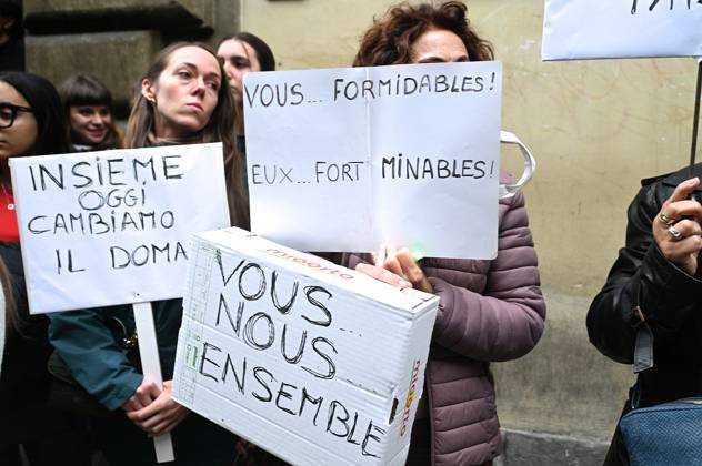 October 23, 2026, Florence, Italia, Italy: In front of the Machiavelli High School on Via Santo Spirito, a group of teachers held an open lesson on the street with megaphones and signs, addressing students leaning out of their windows and standing in front of the occupied school s door. Florence, October 23, 2026 Florence Italy  - ZUMAa289 20261023_zia_a289_113 Copyright: xAleandroxBiagiantix xAgfx