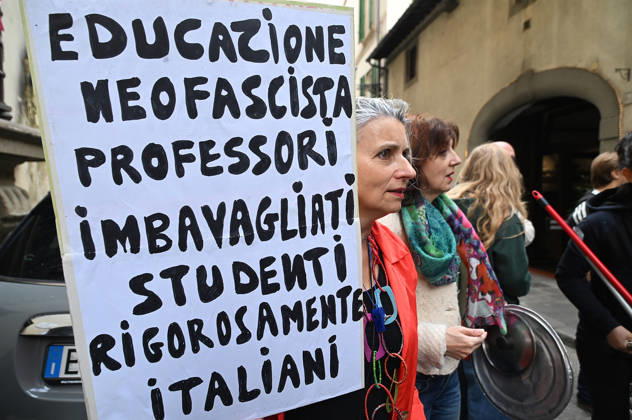 October 23, 2026, Florence, Italia, Italy: In front of the Machiavelli High School on Via Santo Spirito, a group of teachers held an open lesson on the street with megaphones and signs, addressing students leaning out of their windows and standing in front of the occupied school s door. Florence, October 23, 2026 Florence Italy  - ZUMAa289 20261023_zia_a289_119 Copyright: xAleandroxBiagiantix xAgfx