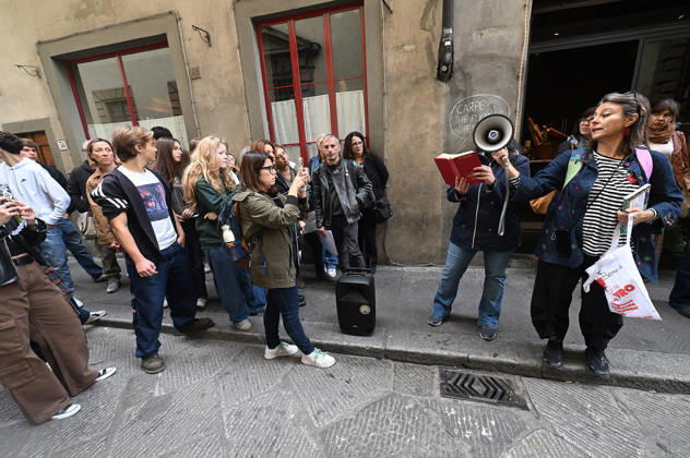 October 23, 2026, Florence, Italia, Italy: In front of the Machiavelli High School on Via Santo Spirito, a group of teachers held an open lesson on the street with megaphones and signs, addressing students leaning out of their windows and standing in front of the occupied school s door. Florence, October 23, 2026 Florence Italy  - ZUMAa289 20261023_zia_a289_131 Copyright: xAleandroxBiagiantix xAgfx