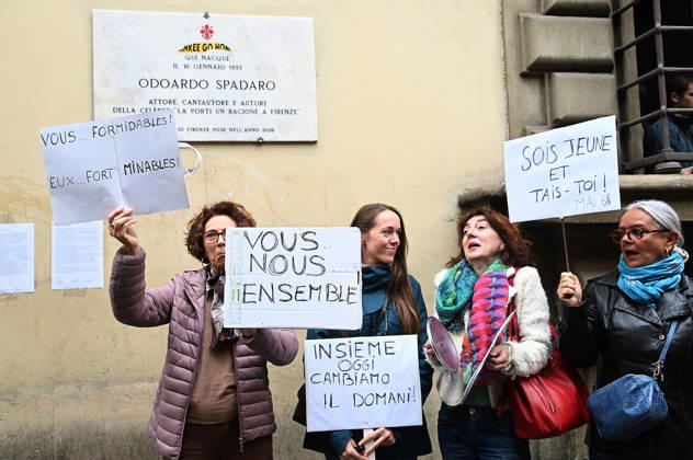 October 23, 2026, Florence, Italia, Italy: In front of the Machiavelli High School on Via Santo Spirito, a group of teachers held an open lesson on the street with megaphones and signs, addressing students leaning out of their windows and standing in front of the occupied school s door. Florence, October 23, 2026 Florence Italy  - ZUMAa289 20261023_zia_a289_133 Copyright: xAleandroxBiagiantix xAgfx