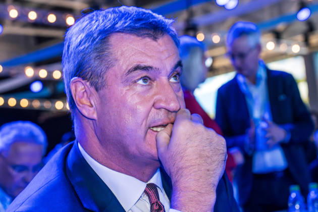 Markus Söder, Minister-President of Bavaria, bathed in the blue light of the LED video wall shining into the dark hall, CSU Party Convention, Munich Trade Fair, October 23, 2026, Germany, Munich, October 23, 2026, Markus Söder, Minister-President of Bavaria, portrait in the blue light shining i