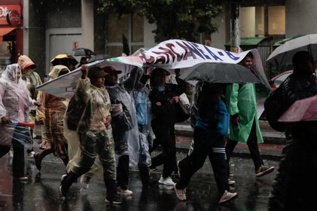 Bolivian teachers march amid the state of emergency in Bolivia LA PAZ, BOLIVIA - OCTOBER 23: Teachers shield themselves from the rain with a sign during an anti-government march amid a state of emergency in La Paz, Bolivia, on October 23, 2026. The Urban Teachers Union is holding a 24-hour nationwide strike this Friday to press a series of demands upon the national government. In La Paz, Cochabamba, Chuquisaca, and Santa Cruz, teachers are staging marches and protests, despite the state of emergency currently in effect in the country. Jorge Mateo Romay Salinas Anadolu La paz Bolivia. Editorial use only. Please get in touch for any other usage.  Copyright: x2026xAnadoluxJorgexMateoxRomayxSalinasx