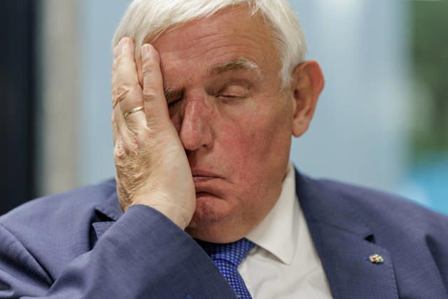 Karl Josef Laumann (CDU), Minister of Labor and Social Affairs for North Rhine-Westphalia, attended a WVS business breakfast on October 23, 2026, at the Caritas Emstor Workshops (WfbM) in Rheine, North Rhine-Westphalia, Germany, runs his hand across his face.