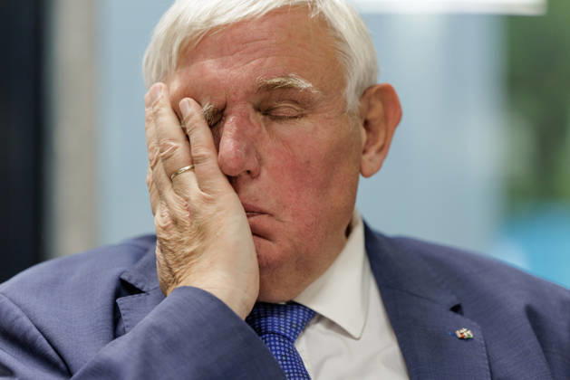 Karl Josef Laumann (CDU), Minister of Labor and Social Affairs for North Rhine-Westphalia, attended a WVS business breakfast on October 23, 2026, at the Caritas Emstor Workshops (WfbM) in Rheine, North Rhine-Westphalia, Germany, runs his hand across his face.