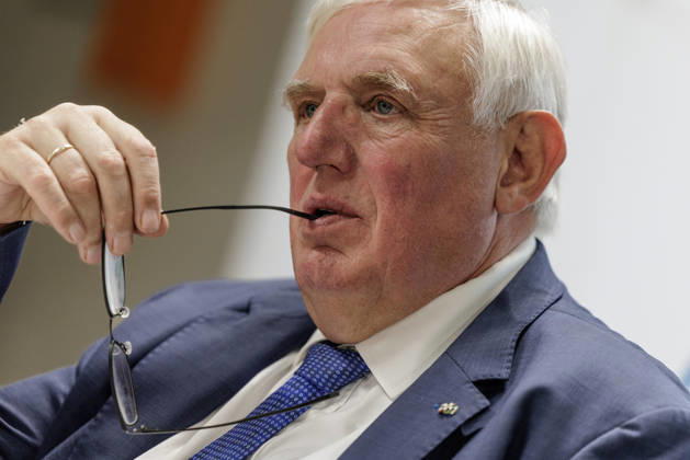 Karl Josef Laumann (CDU), Minister of Labor and Social Affairs for North Rhine-Westphalia, held the arm of his glasses in the corner of his mouth on October 23, 2026, during a WVS business breakfast at the Caritas Emstor Workshops (WfbM) in Rheine, North Rhine