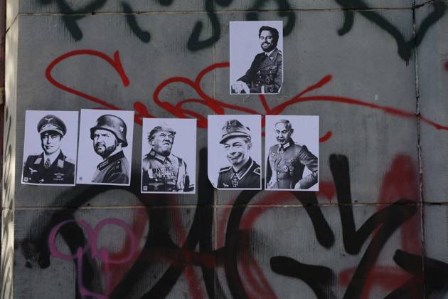 This image show pictures of world leaders on a wall after a call for protests in Brussels for purchasing power, healthcare, and education, on Saturday 24 October 2026.  NICOLASxMAETERLINCK 190856270