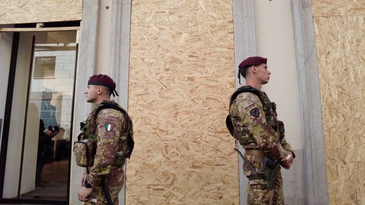 RECORD DATE NOT STATED IPA90116645 - Italy, Milan: Luxury stores on Via Montenapoleone with shop windows barricaded against looting, and soldiers from the Folgore Brigade patrolling the streets to keep out looters and violent protesters  Copyright: xx xRichx IPA90116645