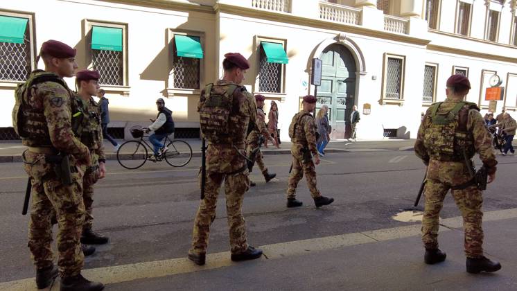 RECORD DATE NOT STATED IPA90116624 - Italy, Milan: Luxury stores on Via Montenapoleone with shop windows barricaded against looting, and soldiers from the Folgore Brigade patrolling the streets to keep out looters and violent protesters  Copyright: xx xRichx IPA90116624