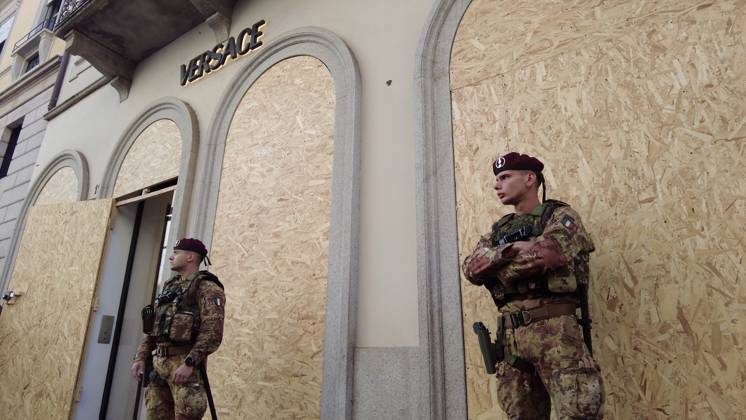 RECORD DATE NOT STATED IPA90116647 - Italy, Milan: Luxury stores on Via Montenapoleone with shop windows barricaded against looting, and soldiers from the Folgore Brigade patrolling the streets to keep out looters and violent protesters  Copyright: xx xRichx IPA90116647