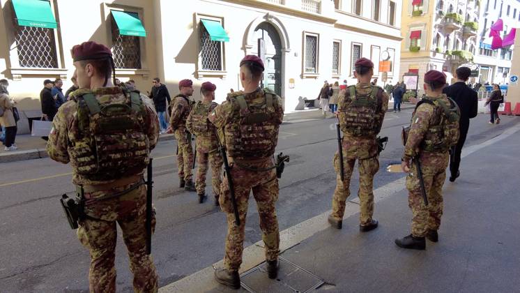 RECORD DATE NOT STATED IPA90116621 - Italy, Milan: Luxury stores on Via Montenapoleone with shop windows barricaded against looting, and soldiers from the Folgore Brigade patrolling the streets to keep out looters and violent protesters  Copyright: xx xRichx IPA90116621