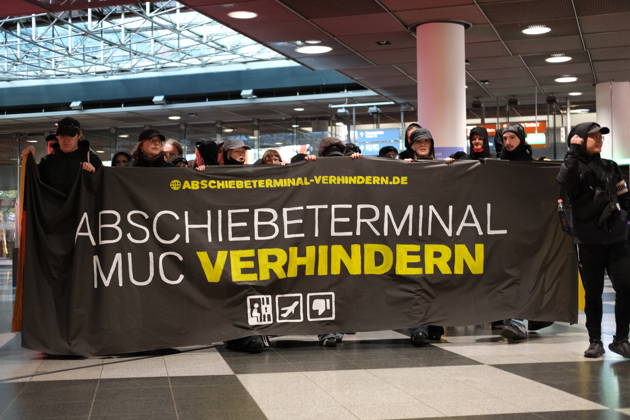 Protest at Munich Airport against planned deportation terminal MUNICH, GERMANY - OCTOBER 24: Protesters carry banner reading Abschiebeterminal MUC verhindern (Stop the MUC Deportation Terminal) inside a terminal building during a demonstration against a planned deportation terminal at Munich Airport in Munich, Germany on October 24, 2026. The campaign, backed by migrant rights groups, opposes federal plans to process deportations at a new facility to be built at the airport from 2028. Merve Goettl Anadolu Munich Germany. Editorial use only. Please get in touch for any other usage.  Copyright: x2026xAnadoluxMervexGoettlx