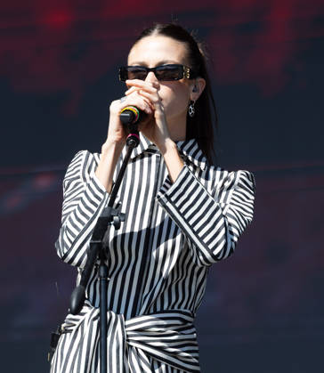 October 24, 2026, Tijuana, Baja California, Mexico: Argentine pop artist OLIVIA WALD holds her microphone with both hands as she sings during her live performance at the Tecate Peninsula 2026 festival at Explanada Estadio Caliente in Tijuana, Baja California, Mexico, October 24, 2026. Tijuana Mexico - ZUMAm311 20261024_zip_m311_002 Copyright: xAlbertoxMartinezx