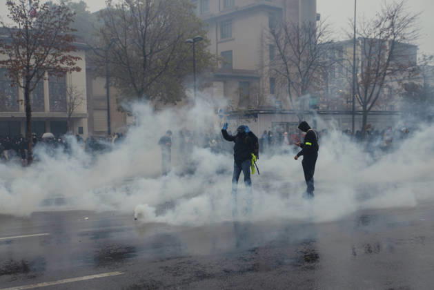 Paris Street Protest Demonstrators stand amid tear gas drifting across a street in Paris, France on October 24, 2026. Authorities deployed around 70,000 security personnel across France for renewed protests over the cost of living on October 24, after unrest a week earlier saw public buildings vandalized, hundreds of shops looted and about 2,700 people arrested. Paris Ile de France France Copyright: xDavoodxMaeilix