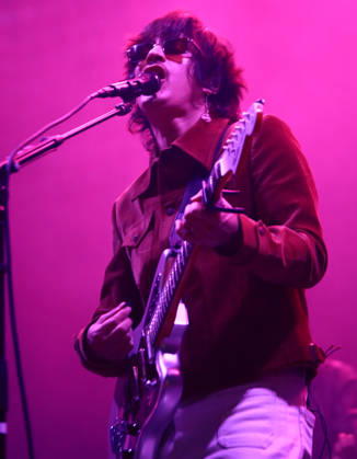 October 24, 2026, Tijuana, Baja California, Mexico: Mexican indie pop musician SIDDHARTHA plays an electric guitar and sings into a microphone under vibrant pink stage lighting during the Tecate Peninsula 2026 music festival at Explanada Estadio Caliente in Tijuana, Baja California, Mexico, October 24, 2026. He wears a brown jacket and dark sunglasses. Tijuana Mexico - ZUMAm311 20261024_zip_m311_010 Copyright: xAlbertoxMartinezx