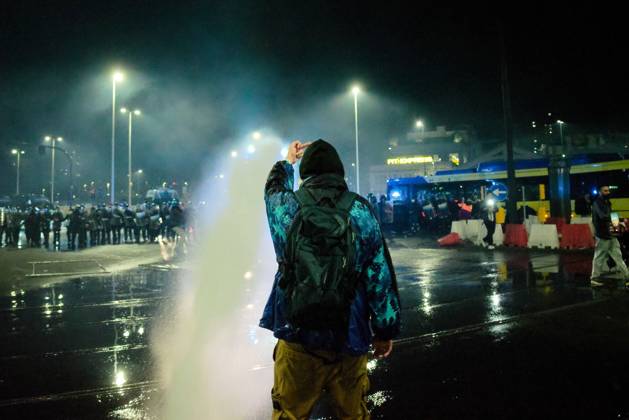 October 24, 2026, Turin, IT: TURIN, ITALY, OCTOBER 24, 2026: Riot police use water cannons and tear gas during confrontations with demonstrators protesting against military rearmament, rising living costs and government policies in Turin. The march begins in Piazza Castello before moving towards northern districts, with clashes occurring as police block protesters from entering streets leading towards the city centre. Turin IT - ZUMAq101 20261024_zna_q101_322 Copyright: xChiaraxAntenuccix