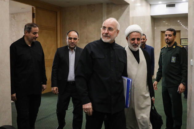 October 25, 2026, Tehran, Iran: Iranian Parliament Speaker Mohammad Bagher Ghalibaf walks through a corridor carrying a blue folder alongside a white-turbaned cleric and other officials at the Islamic Consultative Assembly in Tehran, Iran, on October 25, 2026. Parliamentary reports said more than two-thirds of lawmakers joined the October 25 open sitting of the Islamic Consultative Assembly, attending either in person or remotely. Tehran Iran - ZUMAi98_ 20261025_zih_i98_034 Copyright: xIcanax