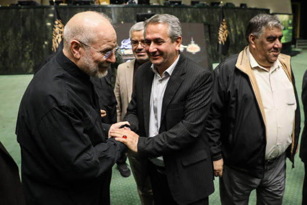 October 25, 2026, Tehran, Iran: Mohammad Bagher Ghalibaf clasps hands with a smiling man in a dark suit while other officials stand nearby at the Islamic Consultative Assembly in Tehran, Iran, on October 25, 2026. The Iranian parliament held a hybrid open sitting, with some lawmakers attending in the Tehran chamber and others participating remotely, according to parliamentary reports. Tehran Iran - ZUMAi98_ 20261025_zih_i98_037 Copyright: xIcanax