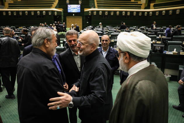 October 25, 2026, Tehran, Iran: Mohammad Bagher Ghalibaf talks animatedly to a gray-haired man in a dark jacket as a cleric stands beside them at the Islamic Consultative Assembly in Tehran, Iran, on October 25, 2026. Speaker Mohammad Bagher Ghalibaf chaired the October 25 session, which combined physical attendance at the Islamic Consultative Assembly with participation by video link. Tehran Iran - ZUMAi98_ 20261025_zih_i98_039 Copyright: xIcanax