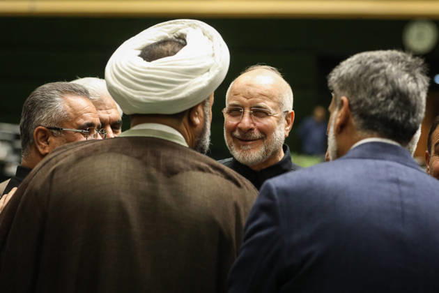 October 25, 2026, Tehran, Iran: Mohammad Bagher Ghalibaf smiles during a conversation with men standing around him, including a white-turbaned cleric at the Islamic Consultative Assembly in Tehran, Iran, on October 25, 2026. Speaker Mohammad Bagher Ghalibaf chaired the October 25 session, which combined physical attendance at the Islamic Consultative Assembly with participation by video link. Tehran Iran - ZUMAi98_ 20261025_zih_i98_041 Copyright: xIcanax