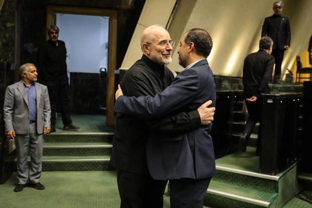 October 25, 2026, Tehran, Iran: Mohammad Bagher Ghalibaf embraces a man in a navy suit beside the steps of the parliament chamber at the Islamic Consultative Assembly in Tehran, Iran, on October 25, 2026. Speaker Mohammad Bagher Ghalibaf chaired the October 25 session, which combined physical attendance at the Islamic Consultative Assembly with participation by video link. Tehran Iran - ZUMAi98_ 20261025_zih_i98_042 Copyright: xIcanax