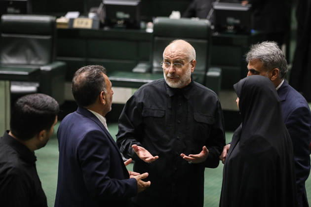 October 25, 2026, Tehran, Iran: Mohammad Bagher Ghalibaf gestures with open hands while speaking with a suited lawmaker and a woman in a black chador at the Islamic Consultative Assembly in Tehran, Iran, on October 25, 2026. The Islamic Consultative Assembly resumed an open sitting in its Tehran chamber with a mix of in-person and remote participation, according to parliamentary reporting. Tehran Iran - ZUMAi98_ 20261025_zih_i98_044 Copyright: xIcanax