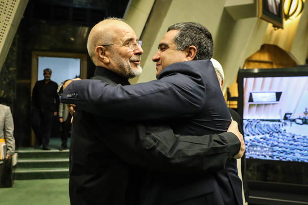 October 25, 2026, Tehran, Iran: Mohammad Bagher Ghalibaf embraces a dark-haired man near the steps leading to the parliamentary dais at the Islamic Consultative Assembly in Tehran, Iran, on October 25, 2026. Parliamentary reports said more than two-thirds of lawmakers joined the October 25 open sitting of the Islamic Consultative Assembly, attending either in person or remotely. Tehran Iran - ZUMAi98_ 20261025_zih_i98_049 Copyright: xIcanax