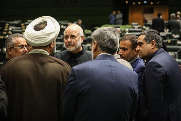 October 25, 2026, Tehran, Iran: Mohammad Bagher Ghalibaf stands in a circle of suited men and a white-turbaned cleric on the chamber floor at the Islamic Consultative Assembly in Tehran, Iran, on October 25, 2026. Parliamentary reports said more than two-thirds of lawmakers joined the October 25 open sitting of the Islamic Consultative Assembly, attending either in person or remotely. Tehran Iran - ZUMAi98_ 20261025_zih_i98_061 Copyright: xIcanax