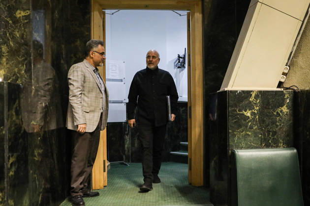 October 25, 2026, Tehran, Iran: Mohammad Bagher Ghalibaf enters the chamber through a doorway as a man in a beige jacket stands to one side at the Islamic Consultative Assembly in Tehran, Iran, on October 25, 2026. The Iranian parliament held a hybrid open sitting, with some lawmakers attending in the Tehran chamber and others participating remotely, according to parliamentary reports. Tehran Iran - ZUMAi98_ 20261025_zih_i98_064 Copyright: xIcanax