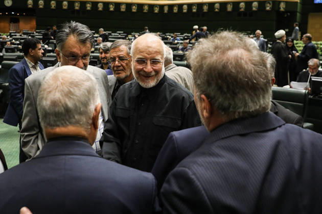 October 25, 2026, Tehran, Iran: Mohammad Bagher Ghalibaf smiles while talking with two men whose backs are to the camera at the Islamic Consultative Assembly in Tehran, Iran, on October 25, 2026. The Islamic Consultative Assembly resumed an open sitting in its Tehran chamber with a mix of in-person and remote participation, according to parliamentary reporting. Tehran Iran - ZUMAi98_ 20261025_zih_i98_057 Copyright: xIcanax