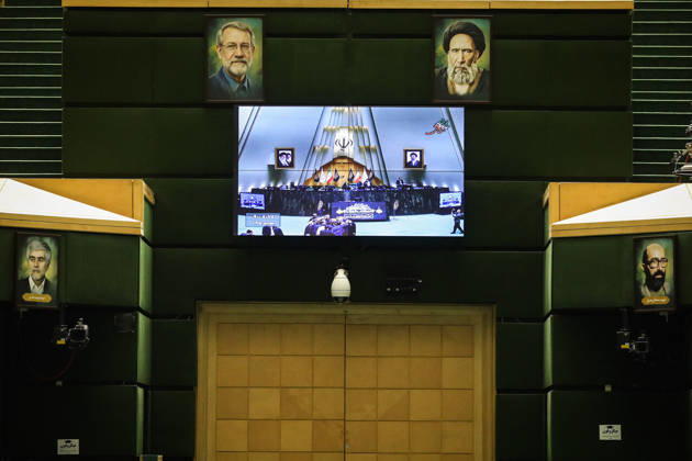 October 25, 2026, Tehran, Iran: A large screen on the back wall of the parliamentary chamber displays a video image of the presiding area at the Islamic Consultative Assembly in Tehran, Iran, on October 25, 2026. The Iranian parliament held a hybrid open sitting, with some lawmakers attending in the Tehran chamber and others participating remotely, according to parliamentary reports. Tehran Iran - ZUMAi98_ 20261025_zih_i98_067 Copyright: xIcanax