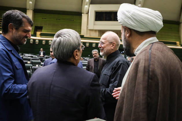 October 25, 2026, Tehran, Iran: Mohammad Bagher Ghalibaf talks with several suited lawmakers as a cleric in a brown robe stands at the edge of the group at the Islamic Consultative Assembly in Tehran, Iran, on October 25, 2026. The Iranian parliament held a hybrid open sitting, with some lawmakers attending in the Tehran chamber and others participating remotely, according to parliamentary reports. Tehran Iran - ZUMAi98_ 20261025_zih_i98_066 Copyright: xIcanax