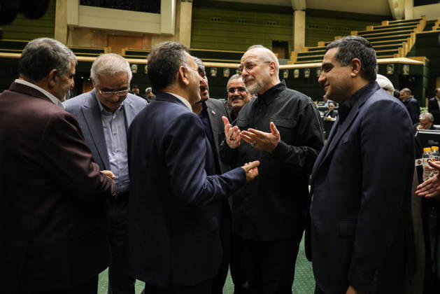 October 25, 2026, Tehran, Iran: Mohammad Bagher Ghalibaf speaks with several members of parliament, raising one hand with fingers spread at the Islamic Consultative Assembly in Tehran, Iran, on October 25, 2026. Speaker Mohammad Bagher Ghalibaf chaired the October 25 session, which combined physical attendance at the Islamic Consultative Assembly with participation by video link. Tehran Iran - ZUMAi98_ 20261025_zih_i98_070 Copyright: xIcanax