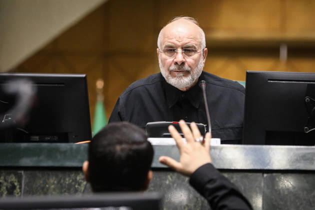 October 25, 2026, Tehran, Iran: Mohammad Bagher Ghalibaf sits between two computer monitors while a raised hand appears in the foreground at the Islamic Consultative Assembly in Tehran, Iran, on October 25, 2026. The Iranian parliament held a hybrid open sitting, with some lawmakers attending in the Tehran chamber and others participating remotely, according to parliamentary reports. Tehran Iran - ZUMAi98_ 20261025_zih_i98_080 Copyright: xIcanax