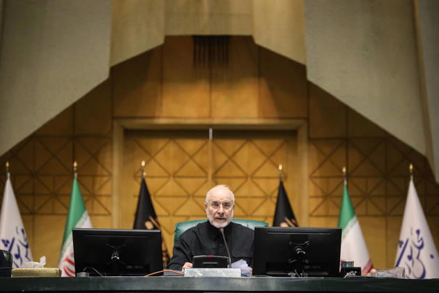 October 25, 2026, Tehran, Iran: Mohammad Bagher Ghalibaf sits alone at the raised presiding desk, flanked by Iranian and parliamentary flags at the Islamic Consultative Assembly in Tehran, Iran, on October 25, 2026. Speaker Mohammad Bagher Ghalibaf chaired the October 25 session, which combined physical attendance at the Islamic Consultative Assembly with participation by video link. Tehran Iran - ZUMAi98_ 20261025_zih_i98_086 Copyright: xIcanax