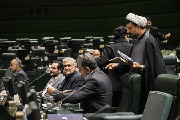 October 25, 2026, Tehran, Iran: A white-turbaned cleric holding papers stands beside a row of seated lawmakers and desk monitors at the Islamic Consultative Assembly in Tehran, Iran, on October 25, 2026. Parliamentary reports said more than two-thirds of lawmakers joined the October 25 open sitting of the Islamic Consultative Assembly, attending either in person or remotely. Tehran Iran - ZUMAi98_ 20261025_zih_i98_093 Copyright: xIcanax