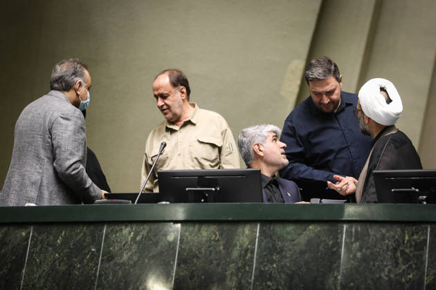 October 25, 2026, Tehran, Iran: Several parliamentary officials gather around the raised front desk, one speaking to a seated colleague at the Islamic Consultative Assembly in Tehran, Iran, on October 25, 2026. Parliamentary reports said more than two-thirds of lawmakers joined the October 25 open sitting of the Islamic Consultative Assembly, attending either in person or remotely. Tehran Iran - ZUMAi98_ 20261025_zih_i98_094 Copyright: xIcanax