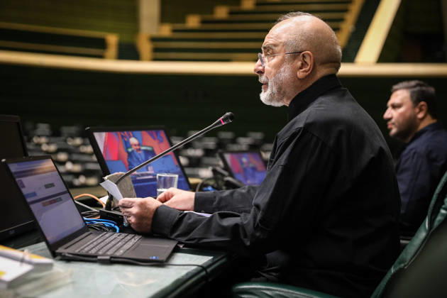 October 25, 2026, Tehran, Iran: Mohammad Bagher Ghalibaf consults papers beside an open laptop and microphones at the presiding desk at the Islamic Consultative Assembly in Tehran, Iran, on October 25, 2026. Parliamentary reports said more than two-thirds of lawmakers joined the October 25 open sitting of the Islamic Consultative Assembly, attending either in person or remotely. Tehran Iran - ZUMAi98_ 20261025_zih_i98_095 Copyright: xIcanax