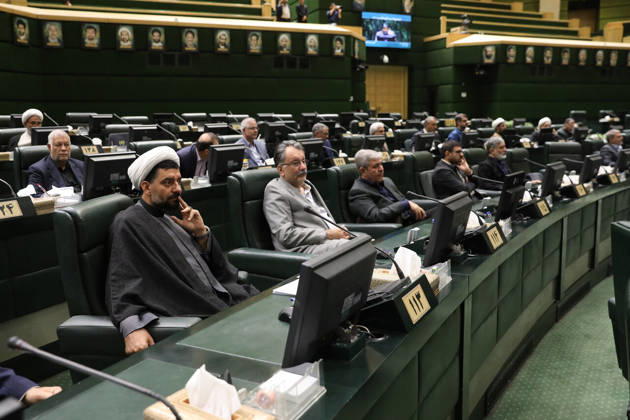 October 25, 2026, Tehran, Iran: Lawmakers sit along a curved row of green benches while a cleric in a white turban occupies a front seat at the Islamic Consultative Assembly in Tehran, Iran, on October 25, 2026. The Iranian parliament held a hybrid open sitting, with some lawmakers attending in the Tehran chamber and others participating remotely, according to parliamentary reports. Tehran Iran - ZUMAi98_ 20261025_zih_i98_098 Copyright: xIcanax