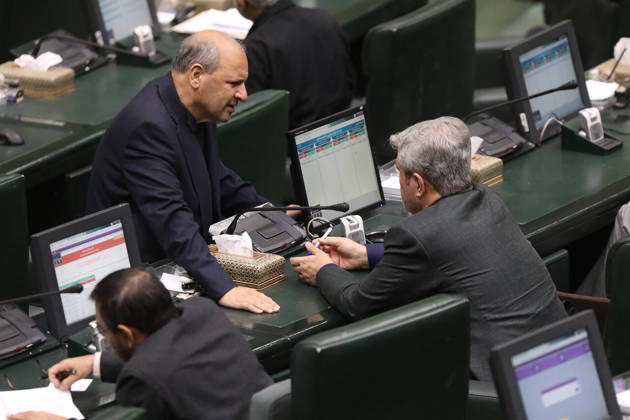 October 25, 2026, Tehran, Iran: A gray-haired man leans forward across the green parliamentary seats to speak to another seated lawmaker at the Islamic Consultative Assembly in Tehran, Iran, on October 25, 2026. The Iranian parliament held a hybrid open sitting, with some lawmakers attending in the Tehran chamber and others participating remotely, according to parliamentary reports. Tehran Iran - ZUMAi98_ 20261025_zih_i98_113 Copyright: xIcanax