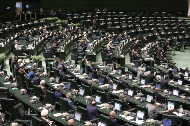 October 25, 2026, Tehran, Iran: A wide view shows lawmakers seated at curved rows of green desks with a number of members raising their hands at the Islamic Consultative Assembly in Tehran, Iran, on October 25, 2026. The Islamic Consultative Assembly resumed an open sitting in its Tehran chamber with a mix of in-person and remote participation, according to parliamentary reporting. Tehran Iran - ZUMAi98_ 20261025_zih_i98_120 Copyright: xIcanax