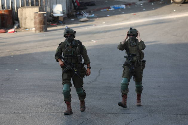 Strict security measures enforced in Hebron s Deir Bahha neighborhood HEBRON, WEST BANK, PALESTINE - OCTOBER 25: Israeli soldiers enforce strict security measures and maintain a military blockade in the Deir Bahha neighborhood of Hebron, West Bank, Palestine on October 25, 2026. The wide-scale military operation entered its third day following an armed attack at an Israeli military checkpoint in the Farsh al-Hawa area at the city s northwestern entrance on October 23, with troops sealing off roads and patrolling residential areas where the two Palestinian suspects involved in the incident lived. Wisam Hashlamoun Anadolu Hebron West Bank. Editorial use only. Please get in touch for any other usage.  Copyright: x2026xAnadoluxWisamxHashlamounx