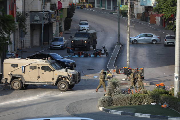 Strict security measures enforced in Hebron s Deir Bahha neighborhood HEBRON, WEST BANK, PALESTINE - OCTOBER 25: Israeli soldiers enforce strict security measures and maintain a military blockade in the Deir Bahha neighborhood of Hebron, West Bank, Palestine on October 25, 2026. The wide-scale military operation entered its third day following an armed attack at an Israeli military checkpoint in the Farsh al-Hawa area at the city s northwestern entrance on October 23, with troops sealing off roads and patrolling residential areas where the two Palestinian suspects involved in the incident lived. Wisam Hashlamoun Anadolu Hebron West Bank. Editorial use only. Please get in touch for any other usage.  Copyright: x2026xAnadoluxWisamxHashlamounx