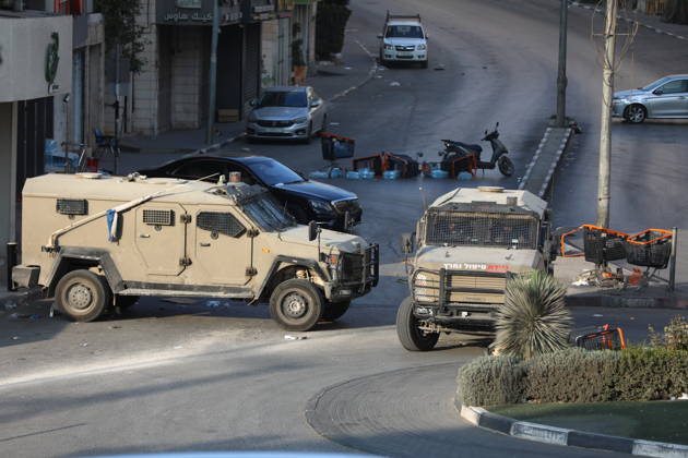 Strict security measures enforced in Hebron s Deir Bahha neighborhood HEBRON, WEST BANK, PALESTINE - OCTOBER 25: Israeli soldiers enforce strict security measures and maintain a military blockade in the Deir Bahha neighborhood of Hebron, West Bank, Palestine on October 25, 2026. The wide-scale military operation entered its third day following an armed attack at an Israeli military checkpoint in the Farsh al-Hawa area at the city s northwestern entrance on October 23, with troops sealing off roads and patrolling residential areas where the two Palestinian suspects involved in the incident lived. Wisam Hashlamoun Anadolu Hebron West Bank. Editorial use only. Please get in touch for any other usage.  Copyright: x2026xAnadoluxWisamxHashlamounx