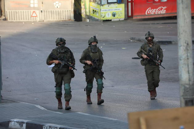 Strict security measures enforced in Hebron s Deir Bahha neighborhood HEBRON, WEST BANK, PALESTINE - OCTOBER 25: Israeli soldiers enforce strict security measures and maintain a military blockade in the Deir Bahha neighborhood of Hebron, West Bank, Palestine on October 25, 2026. The wide-scale military operation entered its third day following an armed attack at an Israeli military checkpoint in the Farsh al-Hawa area at the city s northwestern entrance on October 23, with troops sealing off roads and patrolling residential areas where the two Palestinian suspects involved in the incident lived. Wisam Hashlamoun Anadolu Hebron West Bank. Editorial use only. Please get in touch for any other usage.  Copyright: x2026xAnadoluxWisamxHashlamounx
