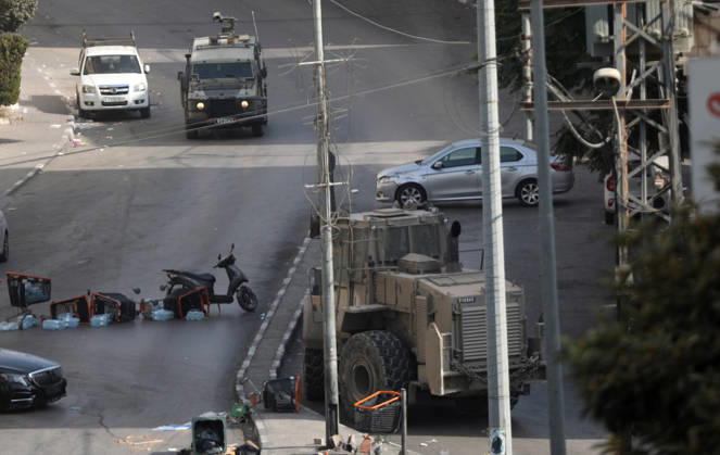(261025) -- HEBRON, Oct. 25, 2026 -- An Israeli military vehicle patrols during a military operation in the West Bank city of Hebron, on Oct. 25, 2026. Israeli military operations continue in Hebron for the third consecutive day, amid ongoing closures and military movements. (Photo by Xinhua) MIDEAST-HEBRON-MILITARY-OPERATION MamounxWazwaz 