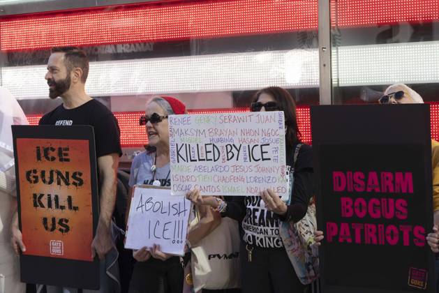 October 25, 2026, New York, New York, USA: Demonstrators with the anti-gun violence organization Gays Against Guns protest under the Times Square US Army Recruiting Station LED American flag to denounce U.S. Immigration and Customs Enforcement (ICE,) President Trump s immigrant detention and mass deportation policies, and to memorialize the people killed by Federal immigration agents. Protesters chant holding signs that read ICE GUNS KILL US ABOLISH ICE!!! KILLED BY ICE DISARM BOGUS PATRIOTS. New York USA  - ZUMAr174 20261025_znp_r174_014 Copyright: xGinaxMxRandazzox