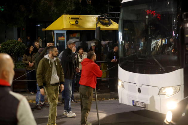 26.10.2026 Belgrade(Serbia) Politics Life Reactions after the election results The fall of the totalitarian regime after 14 years and the change of government Man with a metal bar in front of a bus with police officers in tow